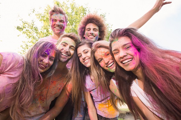 Students in university celebrating holi