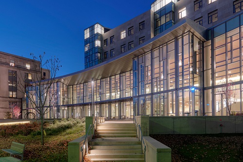 MIT Sloan main building and GMAT scores for top business schools