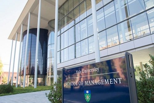 Yale School of Management building and billboard.